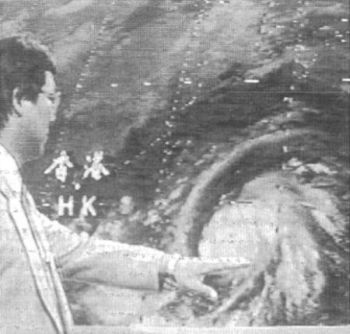 A professional meteorologist appearing in a weather programme on television