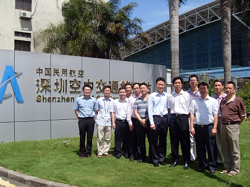 The Observatory's staff taking a photo with the Director of Shenzhen Air Traffic Management Station of CAAC, Mr. Cheng Liangyu (fifth from right) and staff of the Meteorological Station.