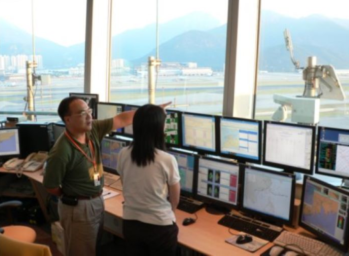 Aviation forecasters keeping a vigilant watch at the Airport Meteorological Office Aviation forecasters at the Airport Meteorological Office