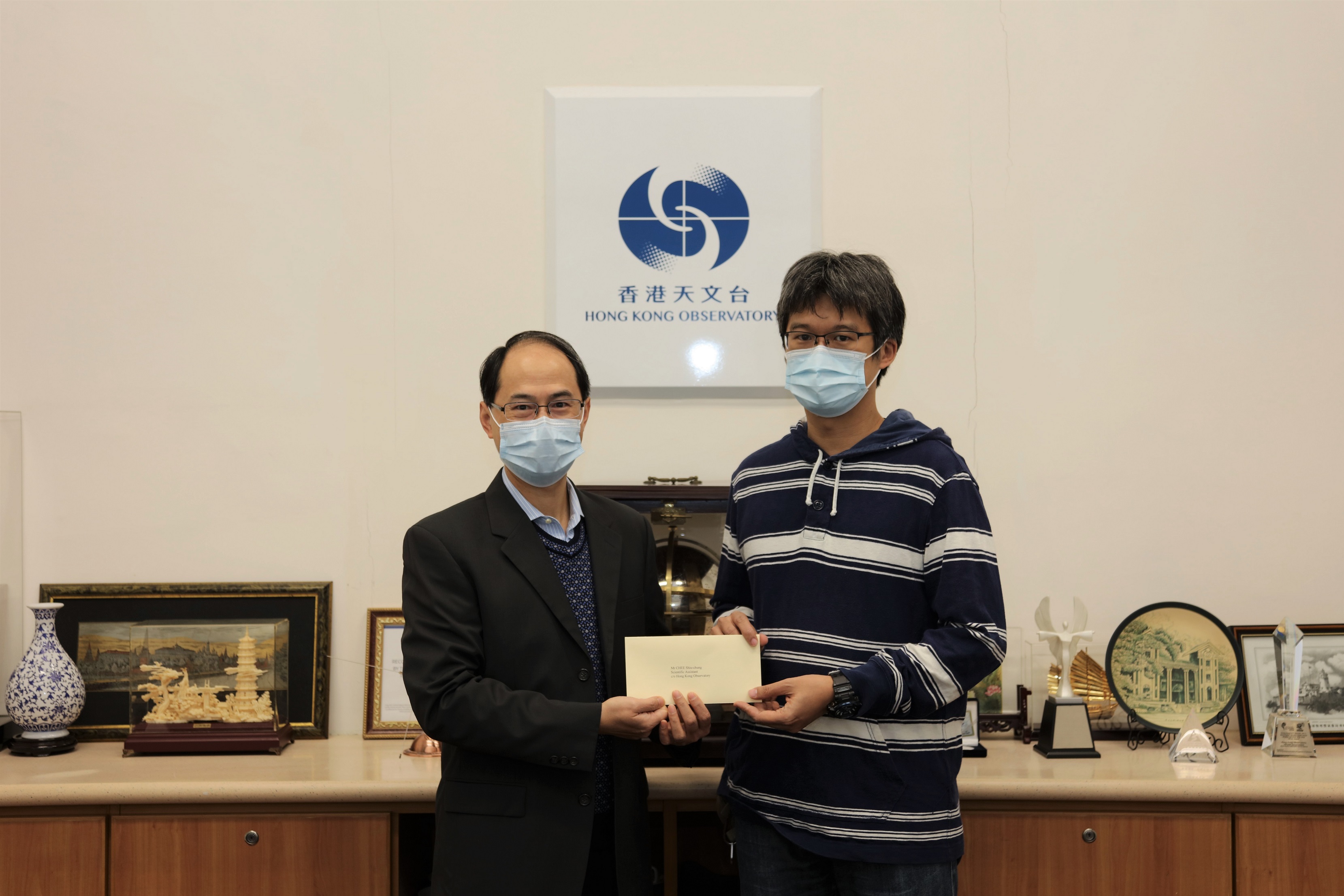 Mr Chee Siu-chung (right) was promoted to Senior Scientific Assistant